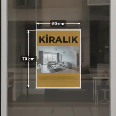 Dükkan vitrinine asılmış 50 x 70 cm kiralık afişi, ölçüleriyle